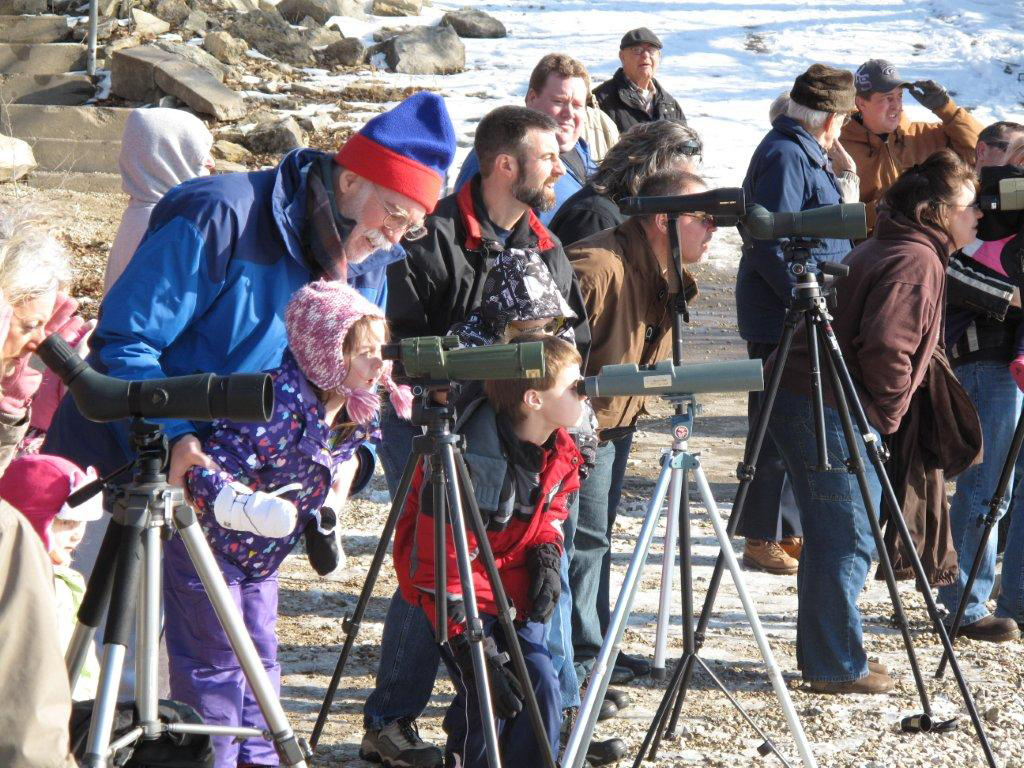 Visitors using scopes to watch bald eagles at Tuttle Creek Lake Eagle Day