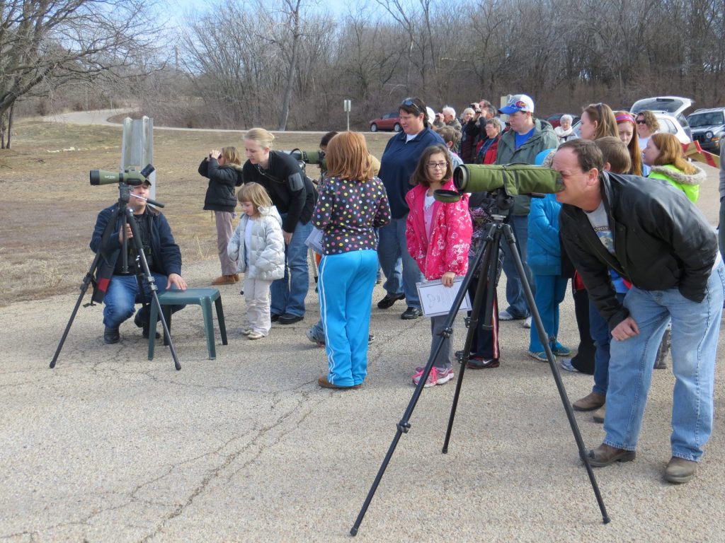 Visitors at Perry Lake Eagles Day watching bald eagles
